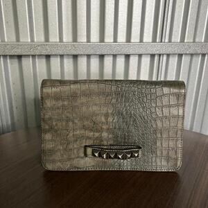 Gray crocodile and boss clutch